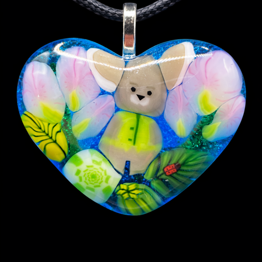 107- Blue glass Murrini heart pendant with bunny.